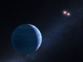Artystyczna wizualizacja planety gazowego olbrzyma krążącego wokół pary czerwonych karłów w układzie OGLE-2007-BLG-349. Fot. NASA, ESA, and G. Bacon (STScI)