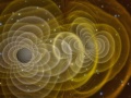 Symulacja łączenia się czarnych dziur – jedno ze zjawisk, które wytwarza najsilniejsze fale grawitacyjne. Fot. by Henze, NASA [Public domain], via Wikimedia Commons